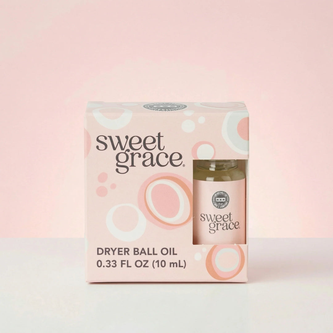 Sweet Grace Dryer Ball Refill, 0.33 fl oz (10 mL), in a windowed pink package with circular patterns.