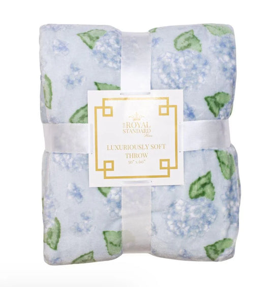 Hydrangea Throw in light blue with floral and leaf pattern. Size: 50” x 60”.