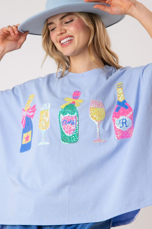 Say Cheers Sequin Loose Fit Top: pastel blue, colorful sequin wine bottle and glass. Available in S-XL.