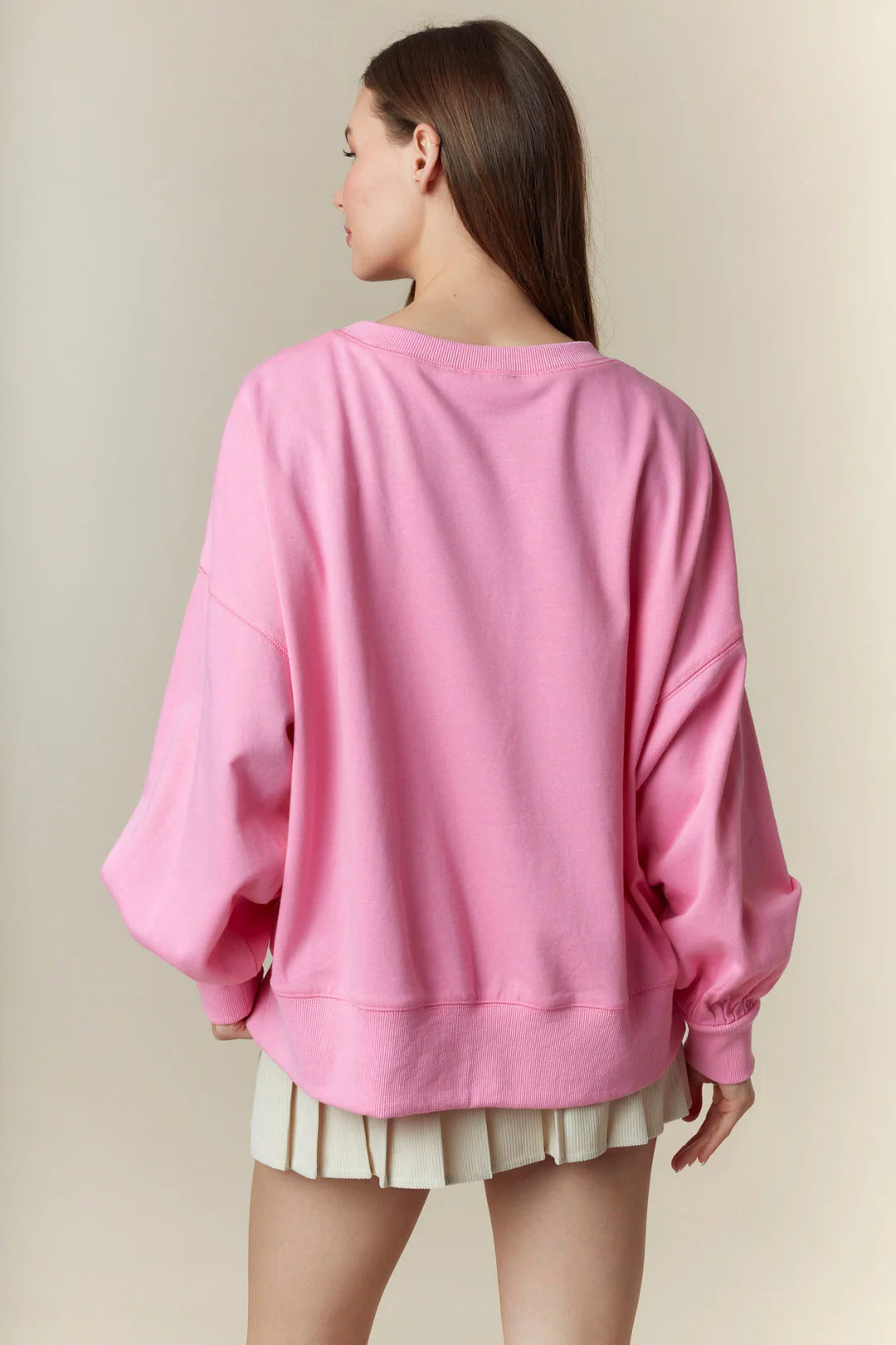 Spooky Boo Pink Patch Sweatshirt—oversized pink top with lace ghost patches. Available in sizes S-XL.