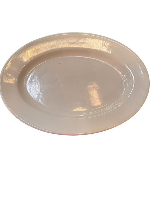 Oval white ceramic platter with glossy surface. Available sizes: 12", 16", and 20".