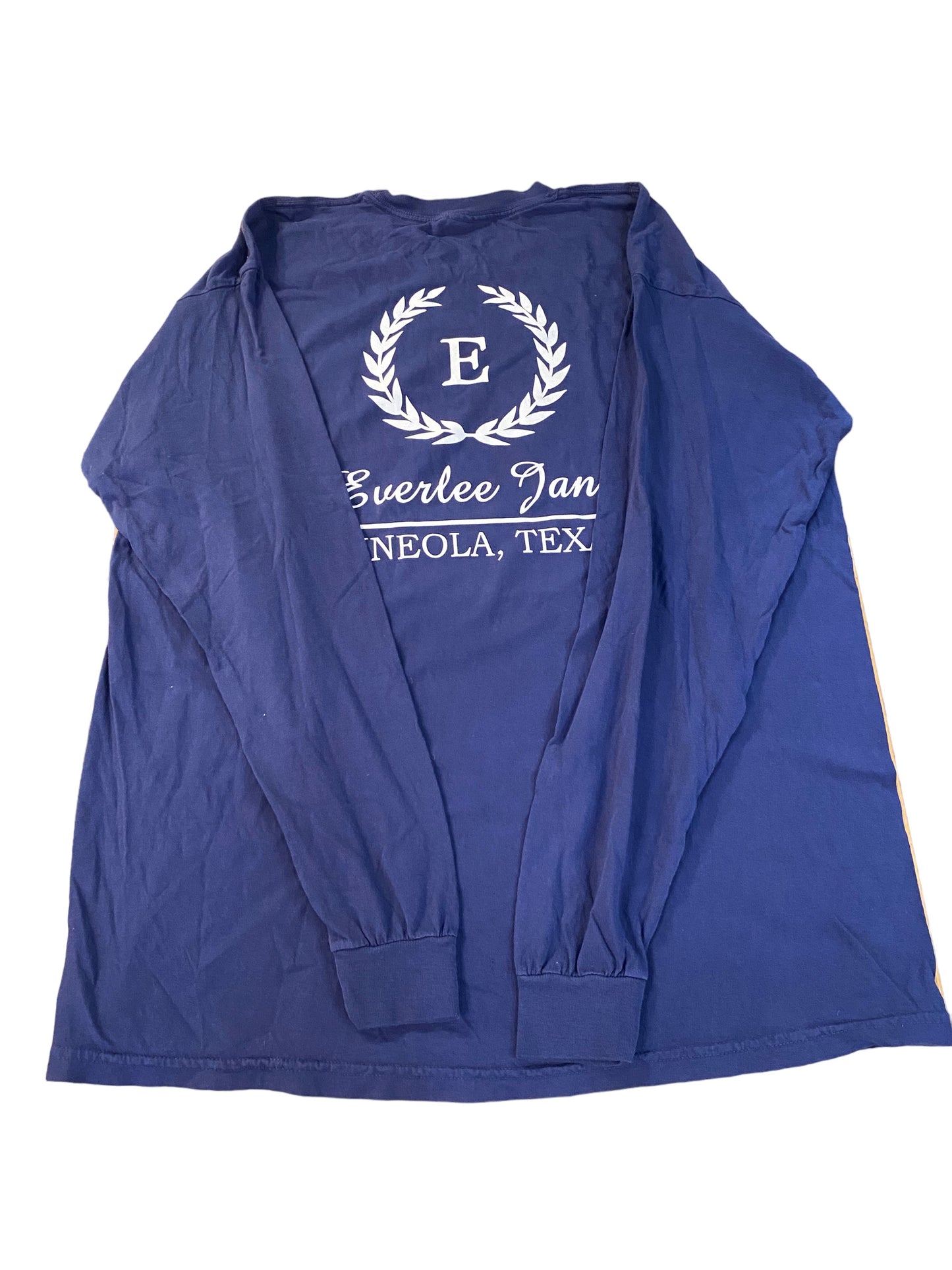 A navy blue windbreaker jacket with a white laurel wreath emblem and the text "Everlee Jane T-Shirt LS" printed in white script on the chest area, laid flat on a