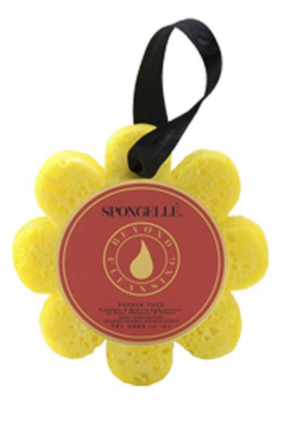 A yellow Spongelle Flowers bathing sponge. The product is shaped like a flower, featuring a maroon and gold label with "spongellé" on it, affixed to a black ribbon. One size only.