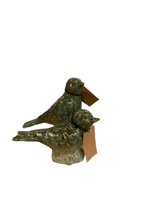 Green stoneware bird figurines with brown neck tags, reactive glaze finish. Available in two sizes.