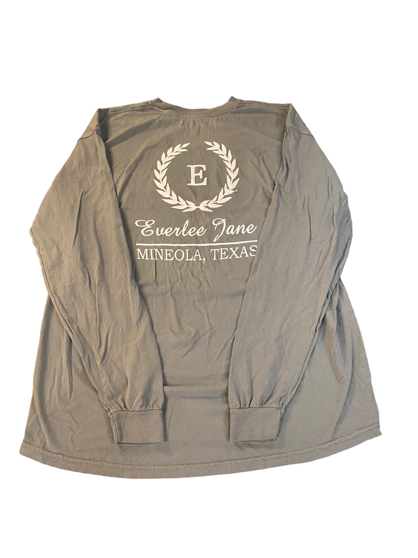 Everlee Jane T-Shirt LS fit.gray long-sleeve shirt with the text "everlee jane" and "mineola, texas" surrounded by a laurel wreath graphic, displayed flat on a white background.