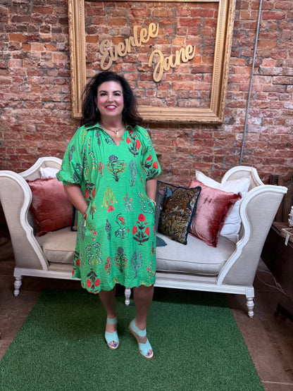 Floral Encyclopedia Print Mini Dress in vivid green, available in sizes XS-XL.