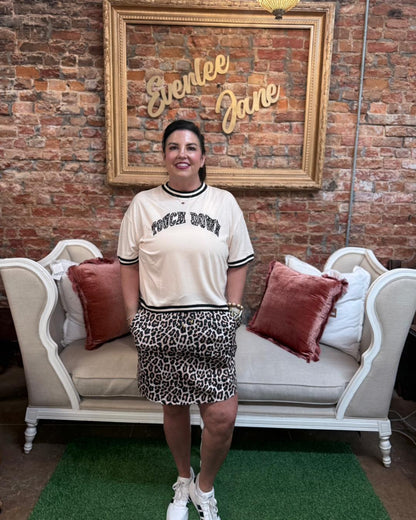 Touch Down Leopard Tee with leopard print design, available in sizes S-XL.