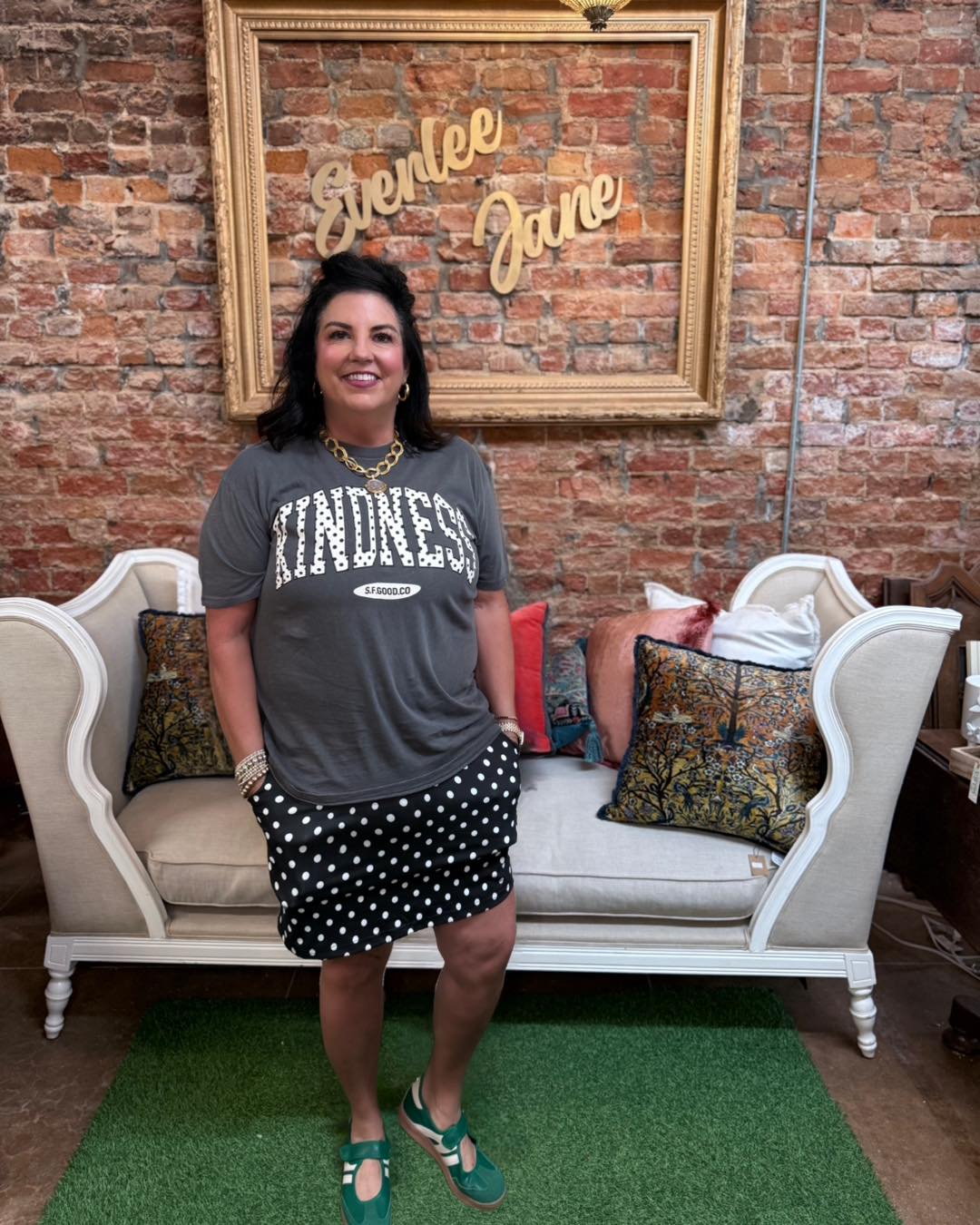 Kindness Polka Dot Graphic Tee with bold lettering and polka dot design; available in sizes S-XL.