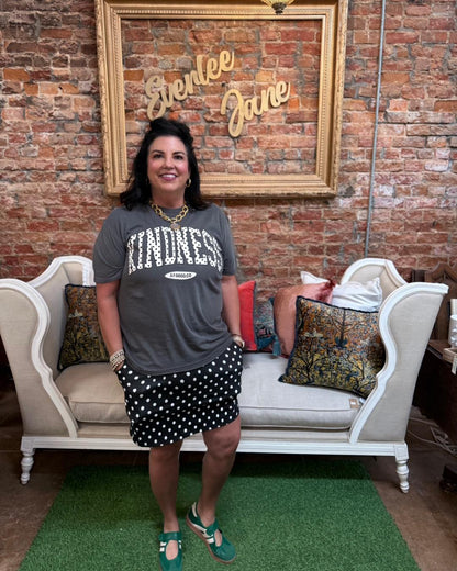 Kindness Polka Dot Graphic Tee with bold lettering and polka dot design; available in sizes S-XL.
