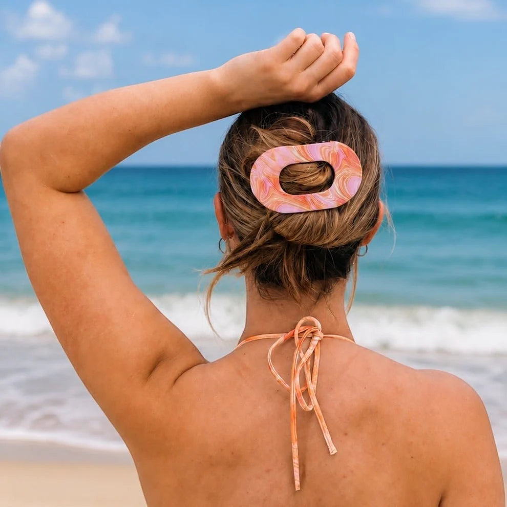 Flat Round Hair Clip | Summer Tie Dye Edition, shown securing hair; available in small, medium, and large sizes.