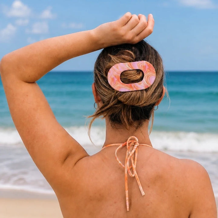 Flat Round Hair Clip | Summer Tie Dye Edition, shown securing hair; available in small, medium, and large sizes.