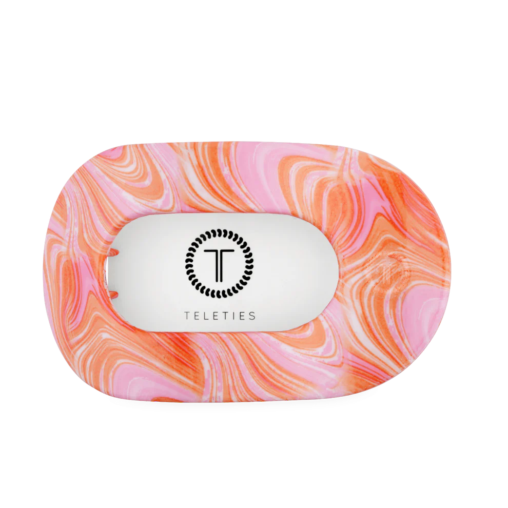 Rectangular, unbreakable pink and orange marbled hair clip with rounded edges, cut-out center, logo. Available in all sizes.