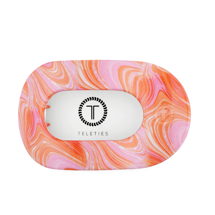 Rectangular, unbreakable pink and orange marbled hair clip with rounded edges, cut-out center, logo. Available in all sizes.