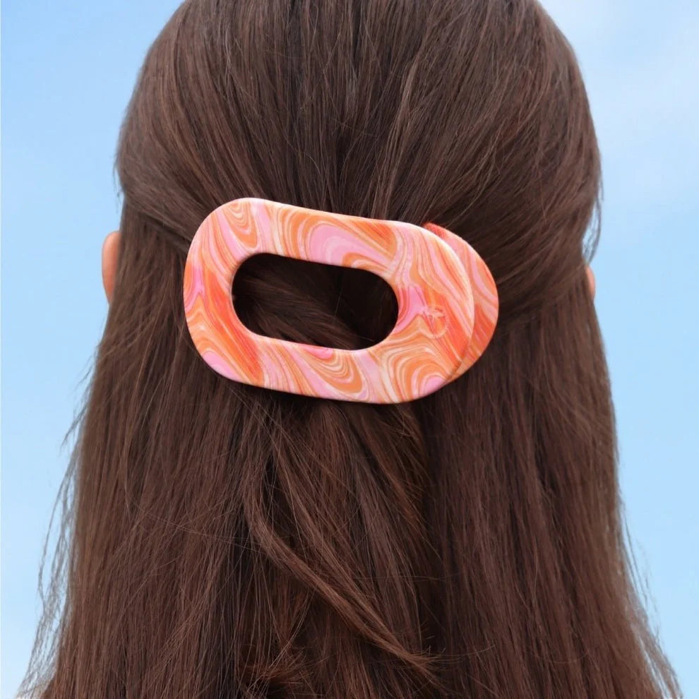 Flat Round Hair Clip | Summer Tie Dye Edition in marbled pink, orange, and white. Available in small and large sizes.