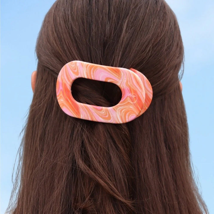 Flat Round Hair Clip | Summer Tie Dye Edition in marbled pink, orange, and white. Available in small and large sizes.