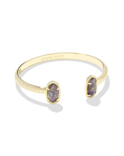 Elton Gold Cuff Bracelet in Bronze Veined Purple Amethyst by Kendra Scott features two oval amethyst stones on each open end, 14k yellow gold setting, engraved inner side, and textured outer band. Sizes available: Small, Medium, Large.