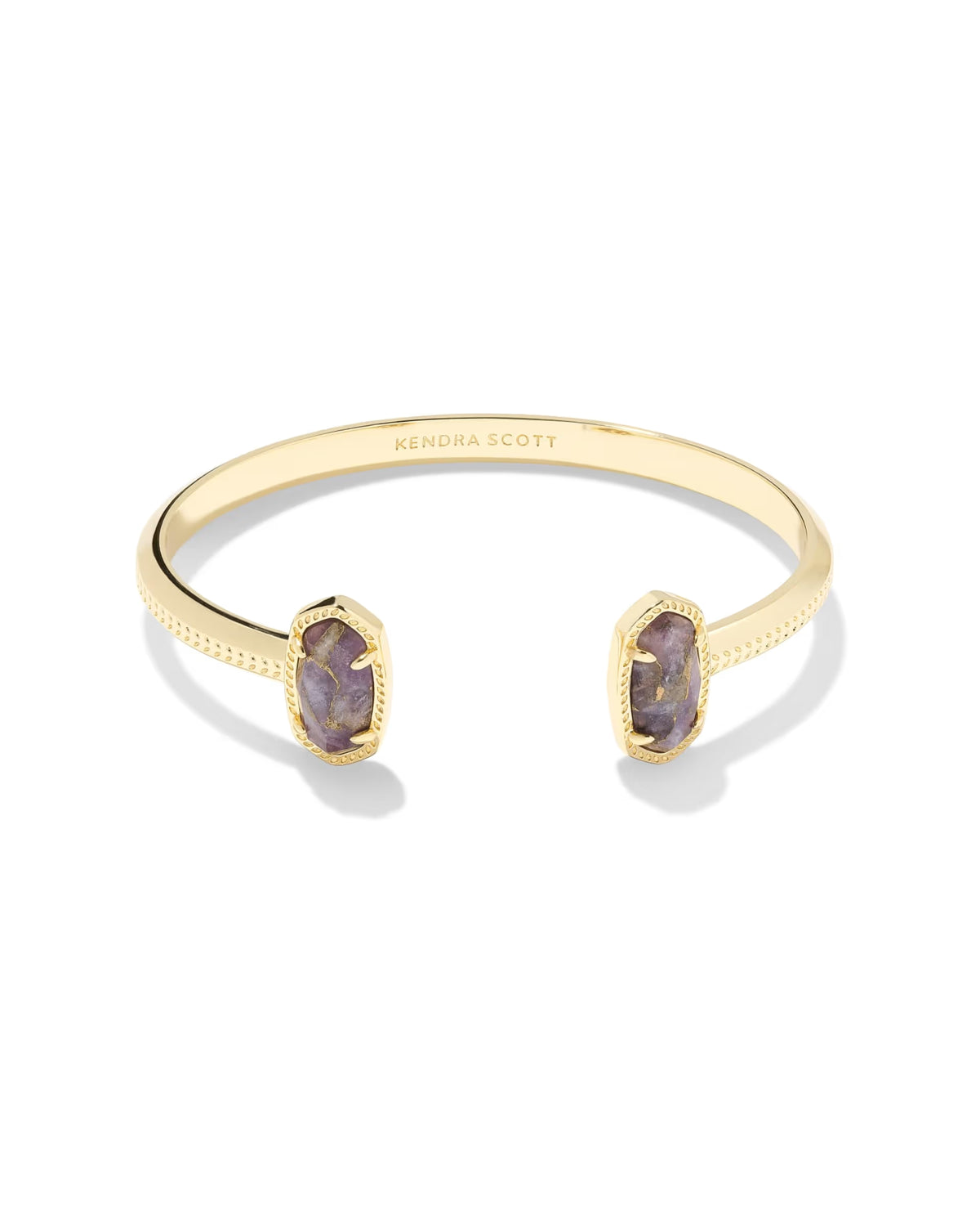 14k yellow gold Elton Gold Cuff Bracelet by Kendra Scott, with bronze veined purple amethyst ends, textured edges, open top, and “Kendra Scott” engraved inside. Sizes available: Small/Medium and Medium/Large.