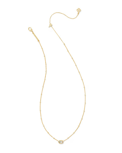 Mini Elisa Gold Satellite Short Pendant Necklace by Kendra Scott with a delicate gold chain, adjustable clasp, and small oval dichroic glass pendant. Available in one size.