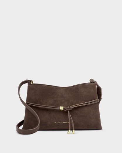 Bitter chocolate Lori Suedette Crossbody Bag with gold accents, knotted adjustable strap, and “Katie Loxton” embossed in gold on the front. Available in multiple sizes.