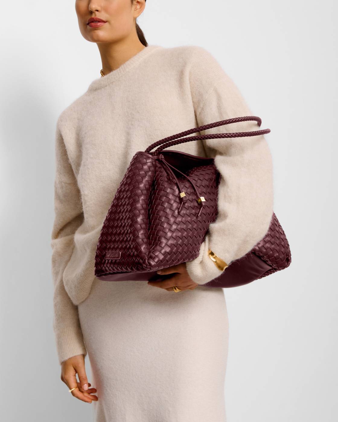 Nova Hand Woven Large Shoulder Bag in Cherry, crafted from woven vegan leather with a textured, basket-like pattern and gold-tone hardware; available in large size.