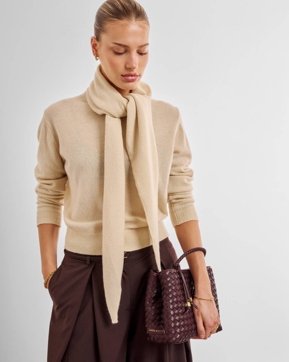 Nova Hand Woven Top Handle Bag in Cherry, available in small and medium sizes.