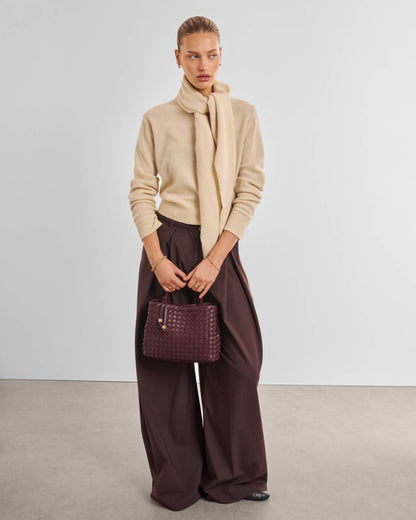 Nova Hand Woven Top Handle Bag in Cherry—textured maroon vegan leather with top handle; available in small, medium, and large sizes.