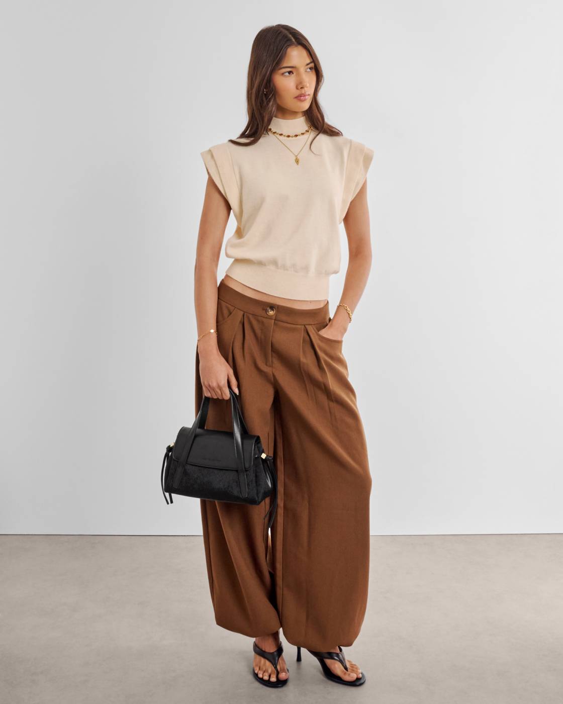 Alyssa Faux Pony Top Handle Bag in Black—vegan leather with detachable crossbody strap; available in one size.