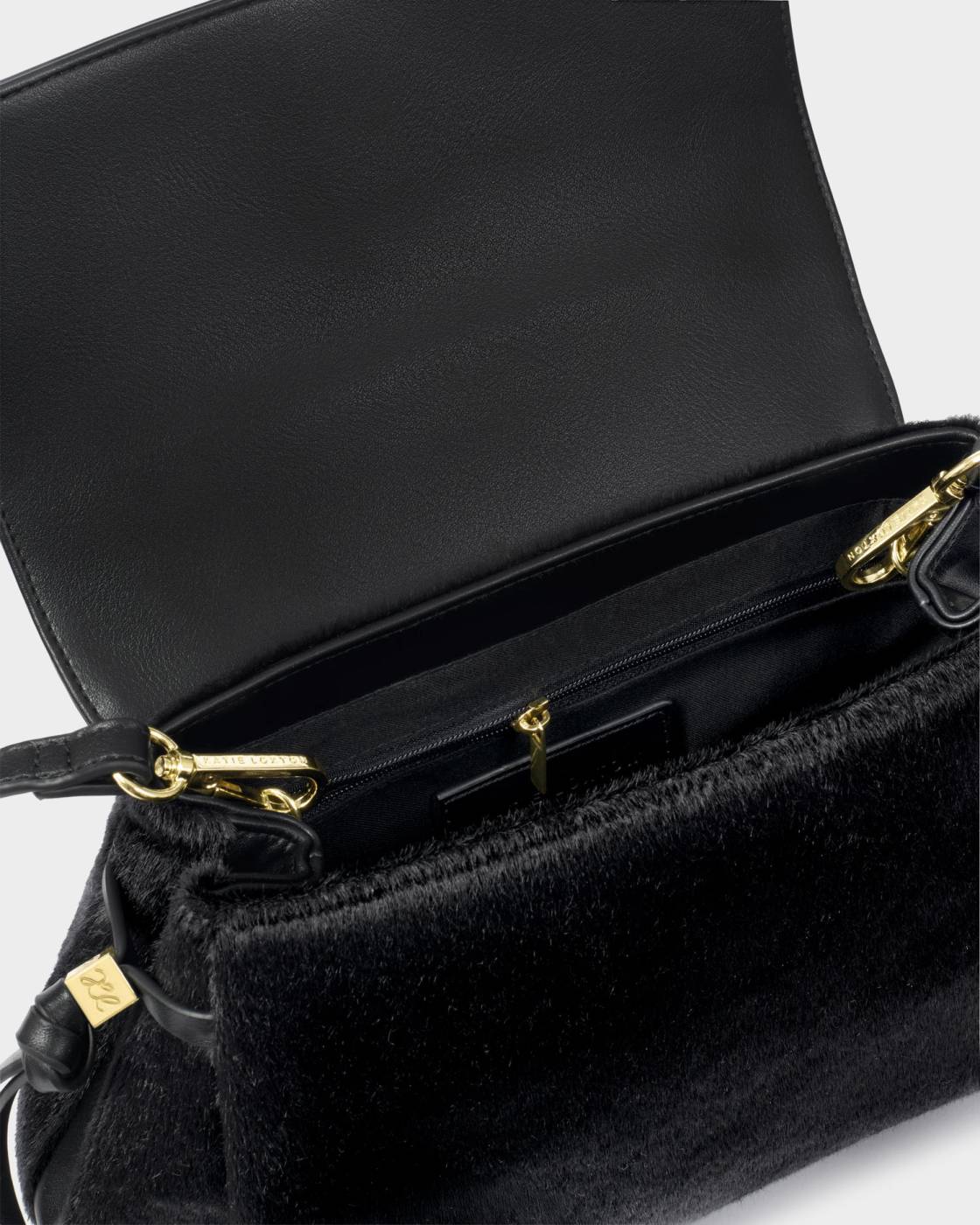 Alyssa Faux Pony Top Handle Bag in black with gold zipper and hardware. Suede-like vegan leather exterior, leather interior, spacious main compartment, zippered pocket, and crossbody strap. Sizes available: Small, Medium.