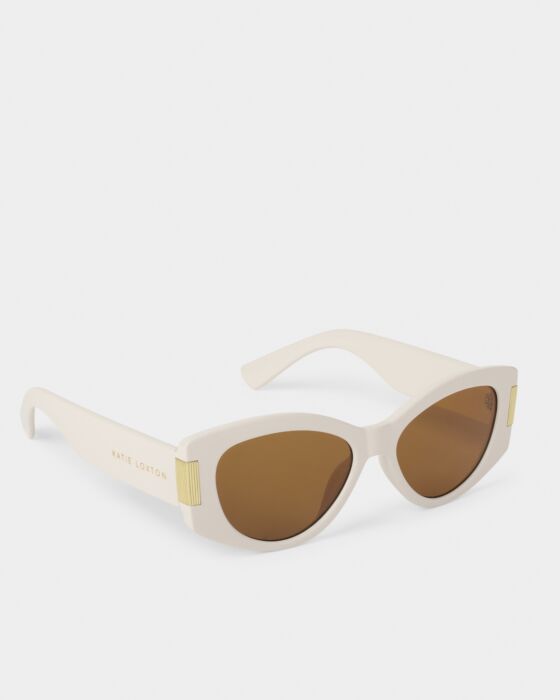Cream cat-eye sunglasses with brown lenses, gold accents, UV400 protection. Three colors. Sizes: S, M, L.