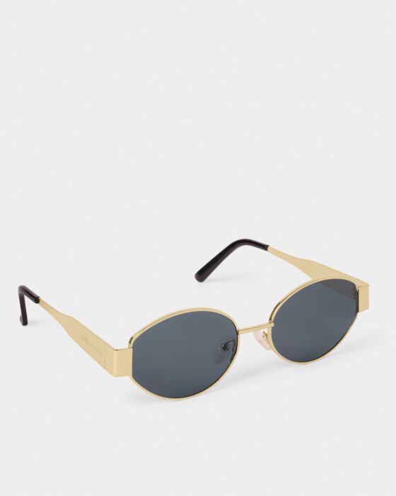 Siena Sunglasses: Oval gold frames, dark UV400 lenses, black arm tips. Available in sizes small, medium, large.