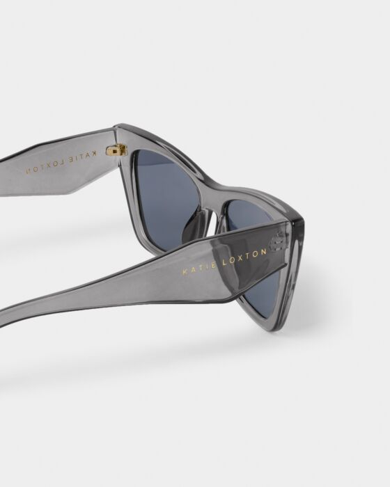 The Porto Sunglasses in transparent gray have dark UV400 lenses, gold branding on the arms, and are available in 2 colors.