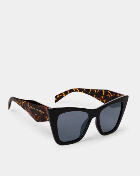 Black cat-eye sunglasses with tortoiseshell arms, UV400 dark lenses, gold text. Available in 2 colors and sizes S/M, M/L.