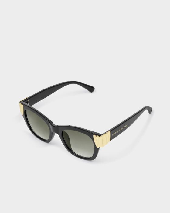 Seychelles Round Cat-Eye Sunglasses with black frame, dark UV400 lenses, gold hinge, “Katie Loxton” on arm. Sizes: One size.