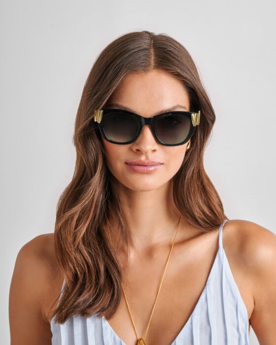 Seychelles Round Cat-Eye Sunglasses in black with UV400 protection, gold temple accents. Available in S, M, L.