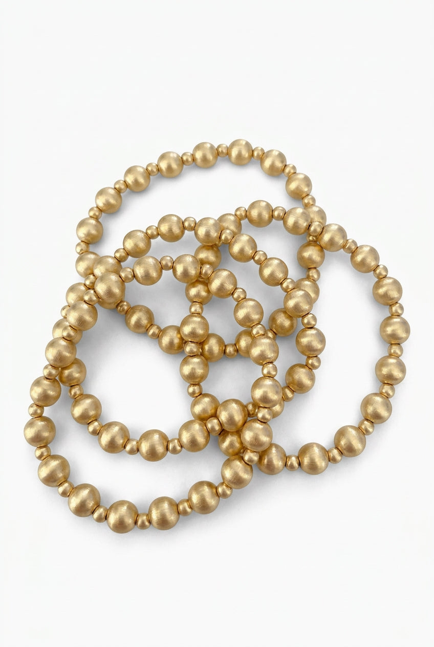 Three Carrie water-resistant stretch beaded bracelets in rose gold, 6 mm beads.