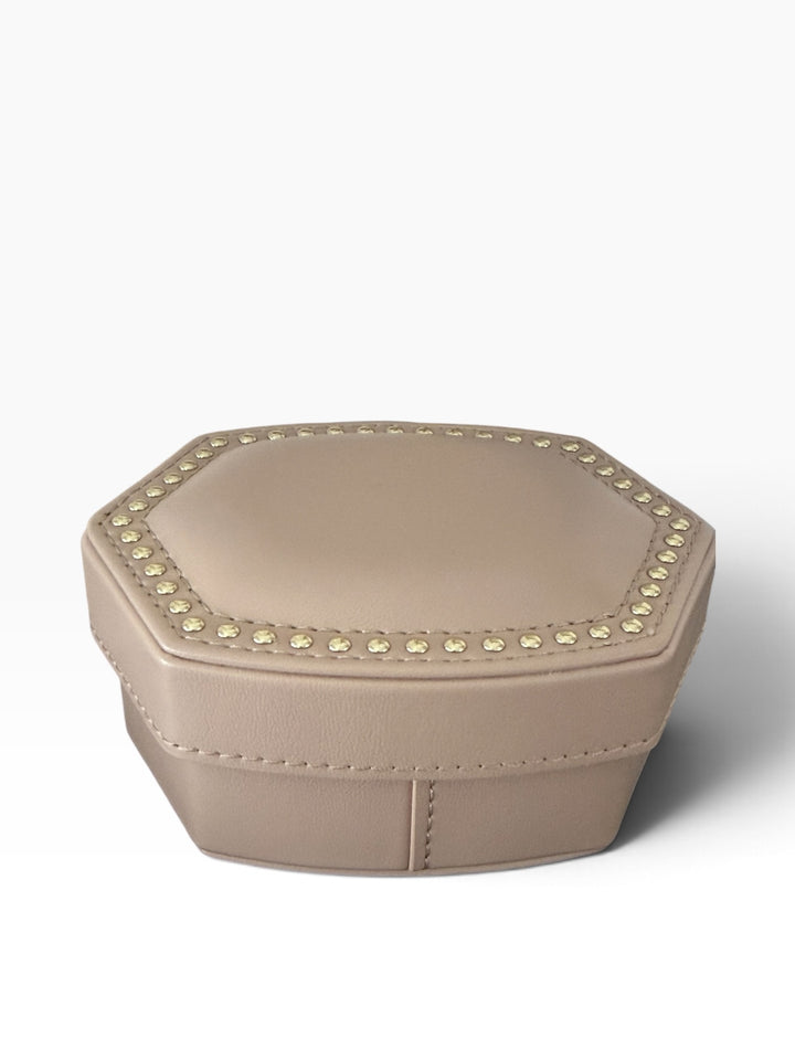 Kendra Scott Daphne Amelia Jewelry Box Set, a neutral hexagonal box with gold stud accents on the lid.