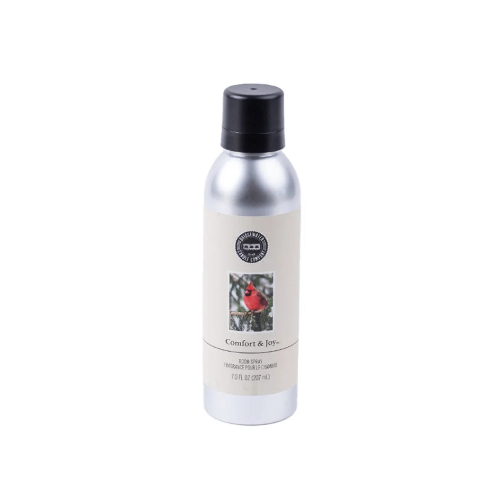 7-ounce Comfort &amp; Joy non-aerosol room spray in a silver bottle with a black cap and red cardinal label.