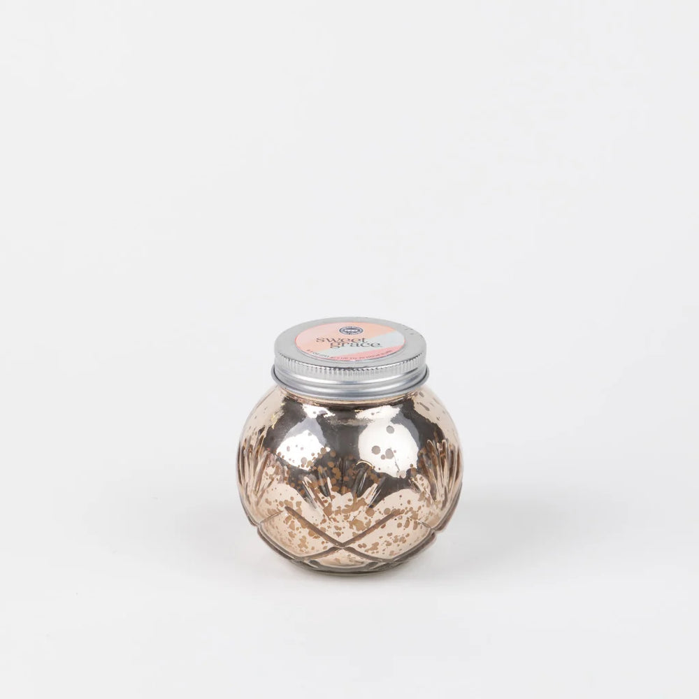 Sweet Grace Collection #008 metallic candle jar with silver lid and textured glass.