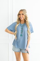 Two-Tone Waffle Knit Top featuring a v neckline and relaxed fit. Available in sizes S, M, L, XL.