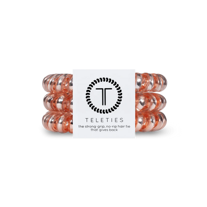 Pack of three transparent peach TELETIES hair ties. Sizes: Small, Large.