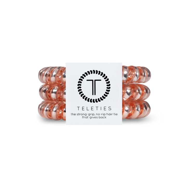 Pack of three transparent peach TELETIES hair ties. Sizes: Small, Large.