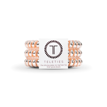 TELETIES Hair Ties: Clear spiral hair ties with a subtle pink tint. Available in sizes: Small and Large.