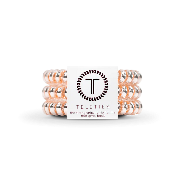 TELETIES Hair Ties: Clear spiral hair ties with a subtle pink tint. Available in sizes: Small and Large.
