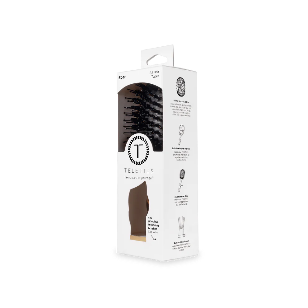 White TELETIES box with Mini Boar Brush | Tortoise, black bristles visible. Mini size. For all hair types, travel-friendly.