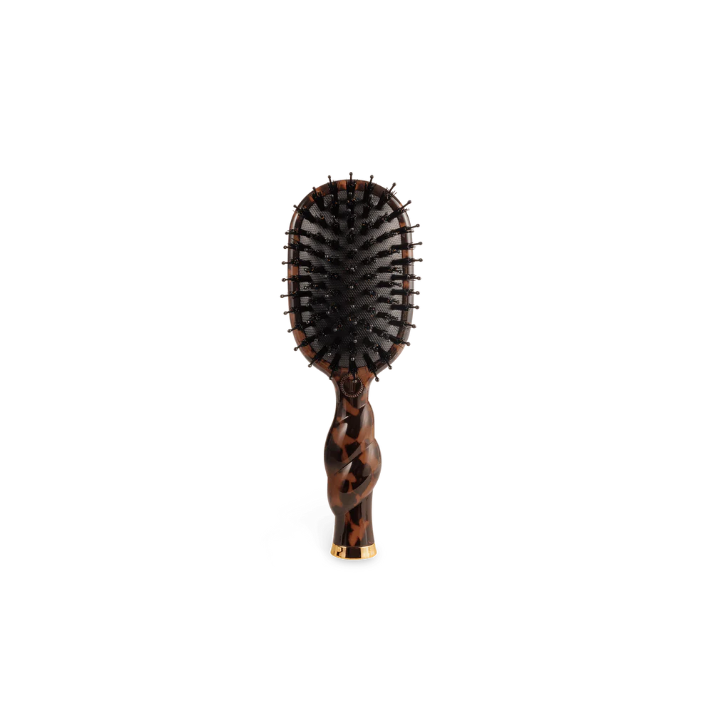 Mini Boar Brush | Tortoise with brown tortoiseshell handle, curved design, black bristles. Available in mini size.