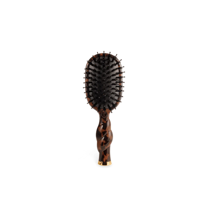 Mini Boar Brush | Tortoise with brown tortoiseshell handle, curved design, black bristles. Available in mini size.