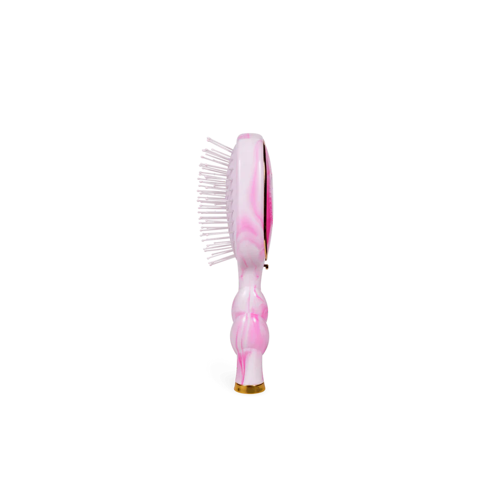 Pink marbled detangler brush with white bristles and a sculpted handle. Available in standard size for medium hair.