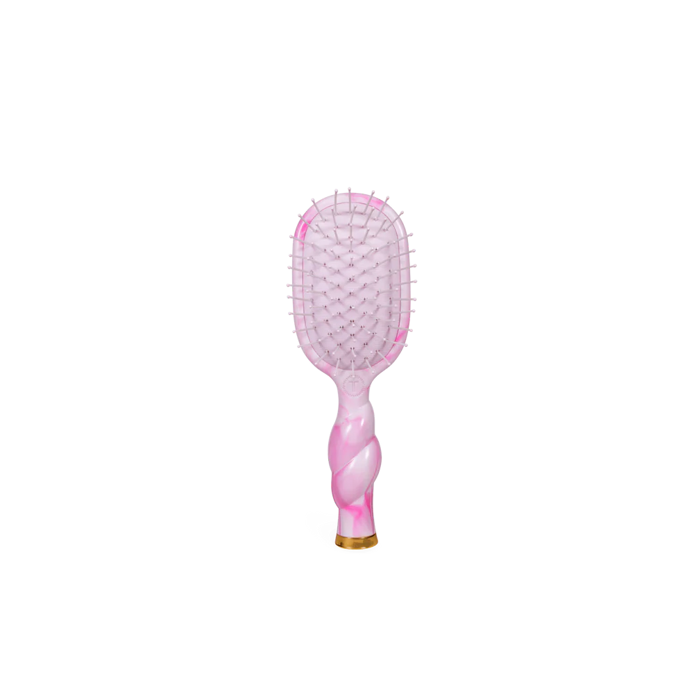Pinch Me! Tie Dye Pink Detangler Hair Brush with pink marbled handle, white bristles. Available in standard size.