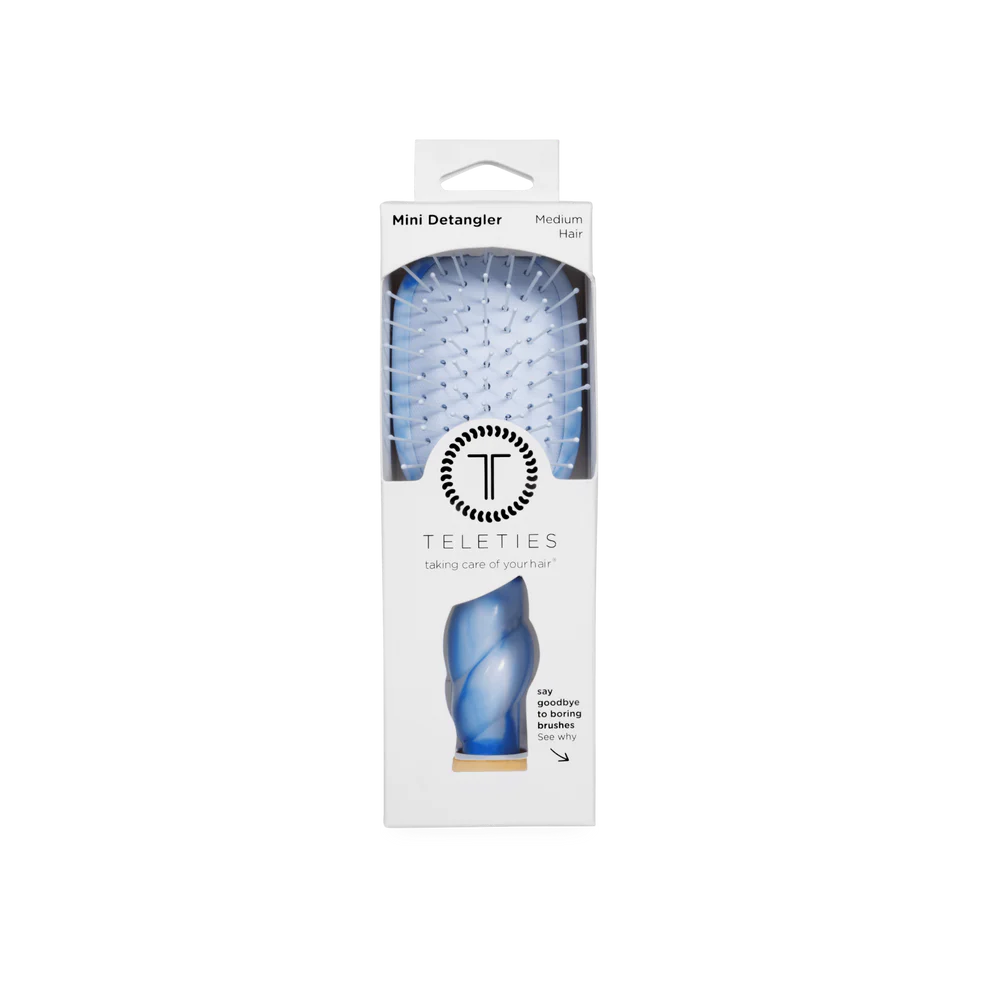 Mini Detangler Brush for Medium Hair in light blue with white bristles, comes in a white Teleties box. Size: Mini.