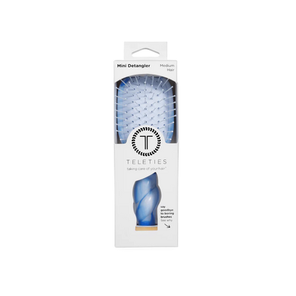 Mini Detangler Brush for Medium Hair in light blue with white bristles, comes in a white Teleties box. Size: Mini.